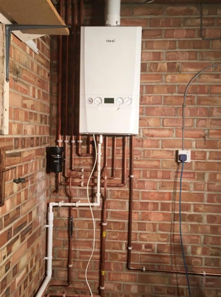 Gas boiler with tidy copper pipework and system filter, serviced by our Gas Safe engineers
